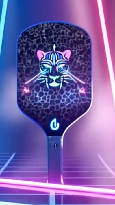 Leopard pickleball paddles with animal designs on a vibrant, neon-lit background.